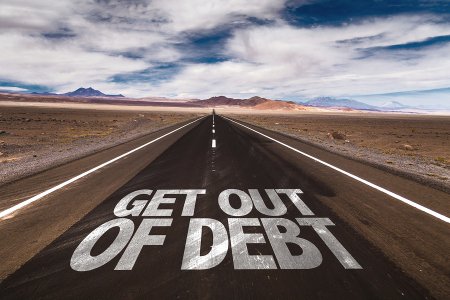 Long Road with 'Debt' written, suggesting estate planning for debt resolution in Tracy, CA
