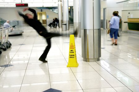 Warning sign on a wet floor, related to slip and fall lawsuit in Tracy, CA