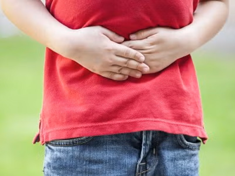 A person suffering from stomach ache related to food poisoning lawsuits in Tracy, CA