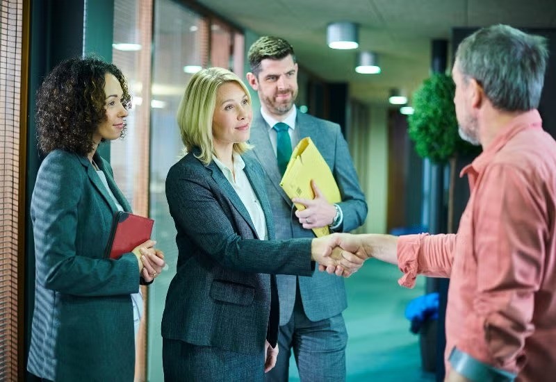 Experienced Bus Accident Lawyers Greeting the Client in Tracy, CA
